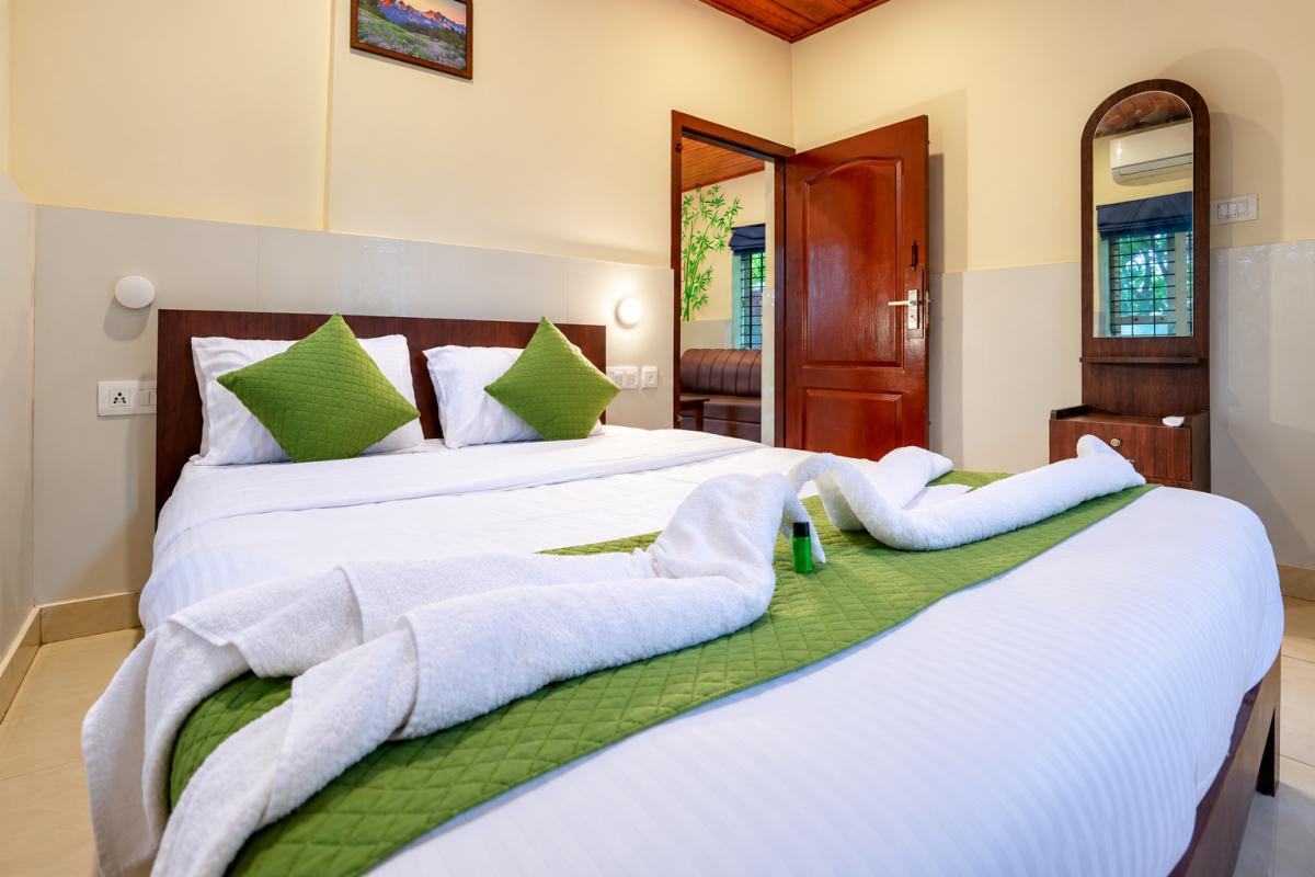 Cozy Hotel Bedroom with Towel Art