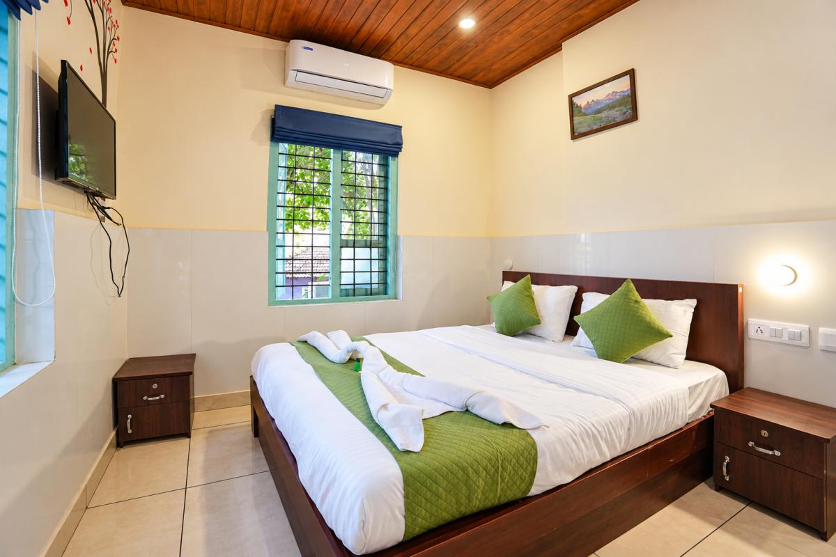 Modern Guest Bedroom with Green Accents