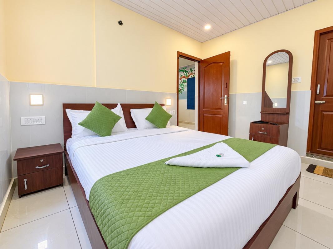 Modern Hotel Bedroom with Green Accents