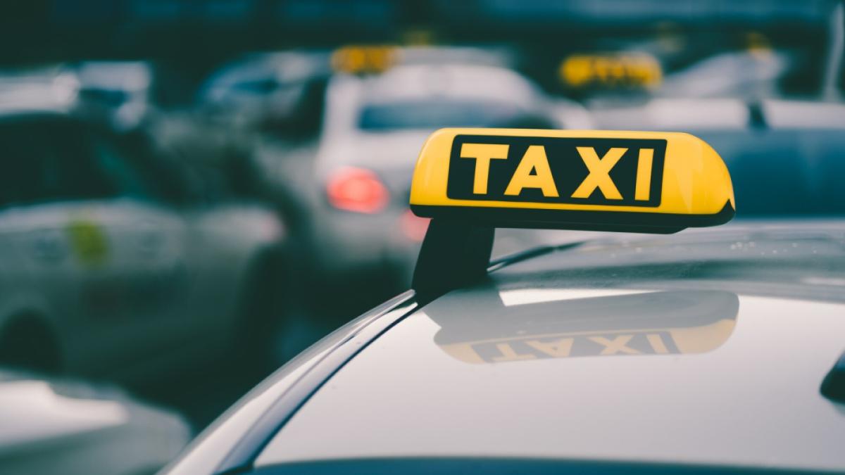 selective-focus-shot-yellow-taxi-sign-traffic-jam_181624-42635